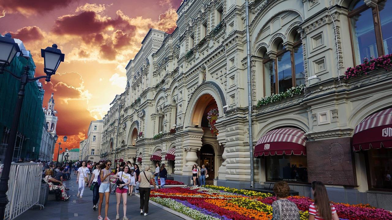 Airplane flying above scenic landscape — cheap flights and travel deals with Camelot Travel